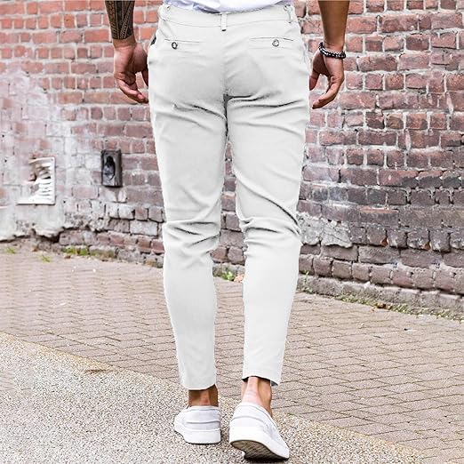 LV Signature Luxury Trouser worn casually, showcasing a sleek tailored design against a brick wall.