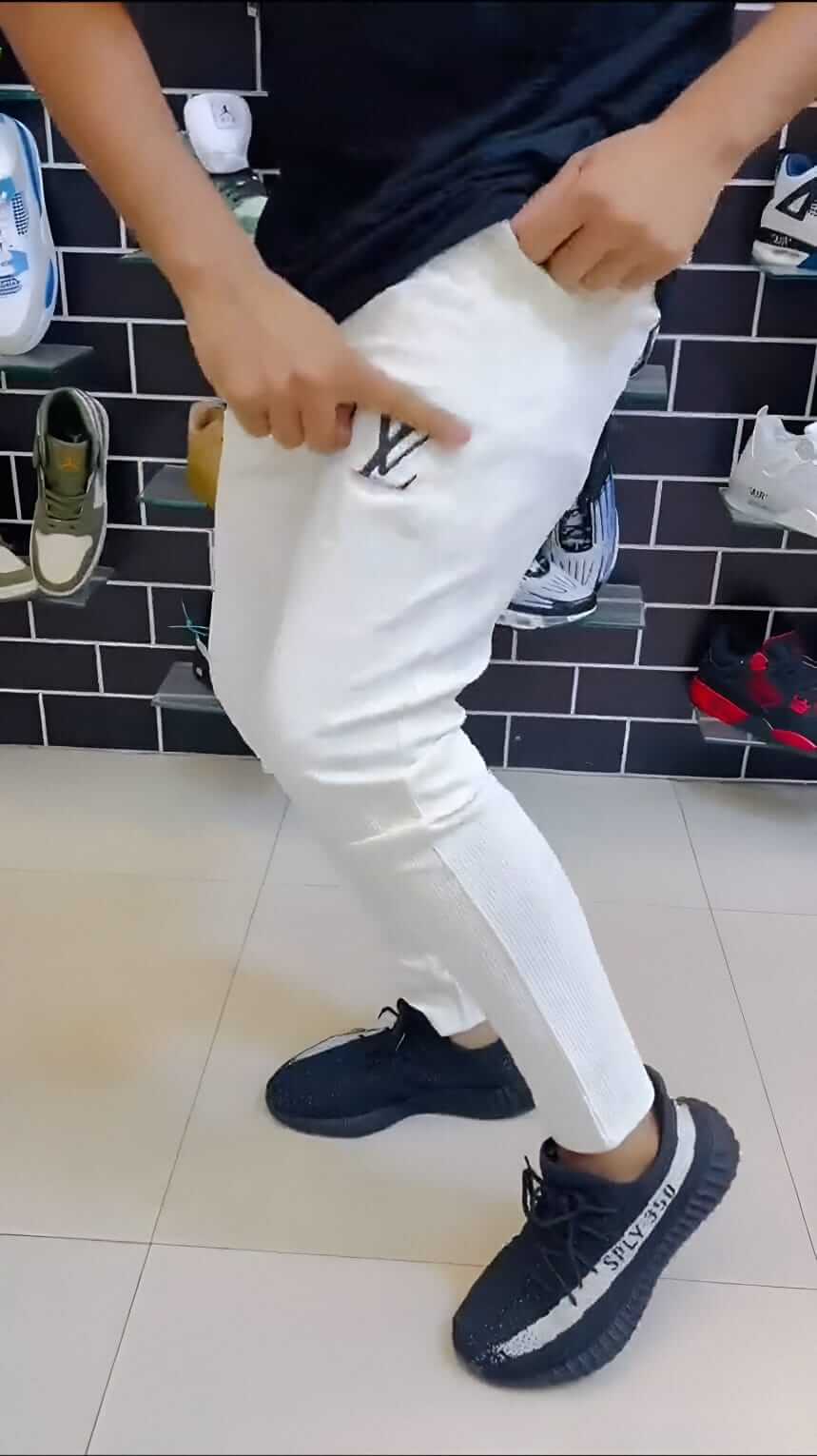 Person wearing LV Signature Luxury Trouser, highlighting its tailored fit and luxury fabric.