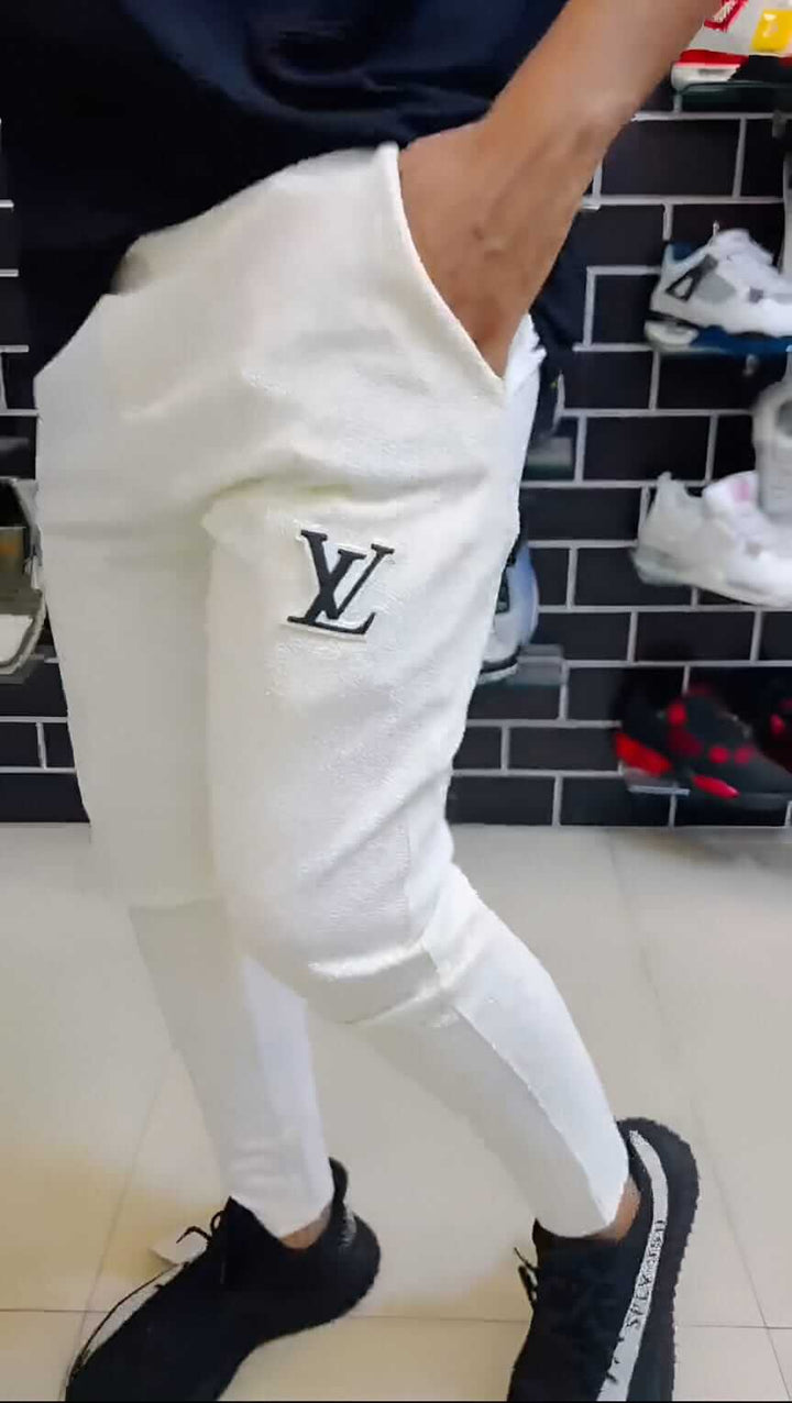 LV Signature Luxury Trouser showcased in stylish white fabric with tailored fit and signature logo detail.