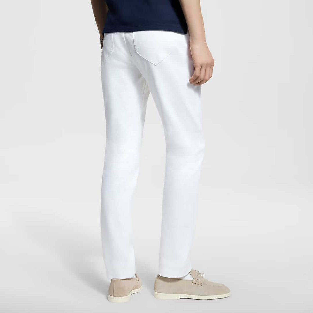 Back view of a model wearing LV Signature Luxury Trouser in white, showcasing premium fabric and tailored elegance.