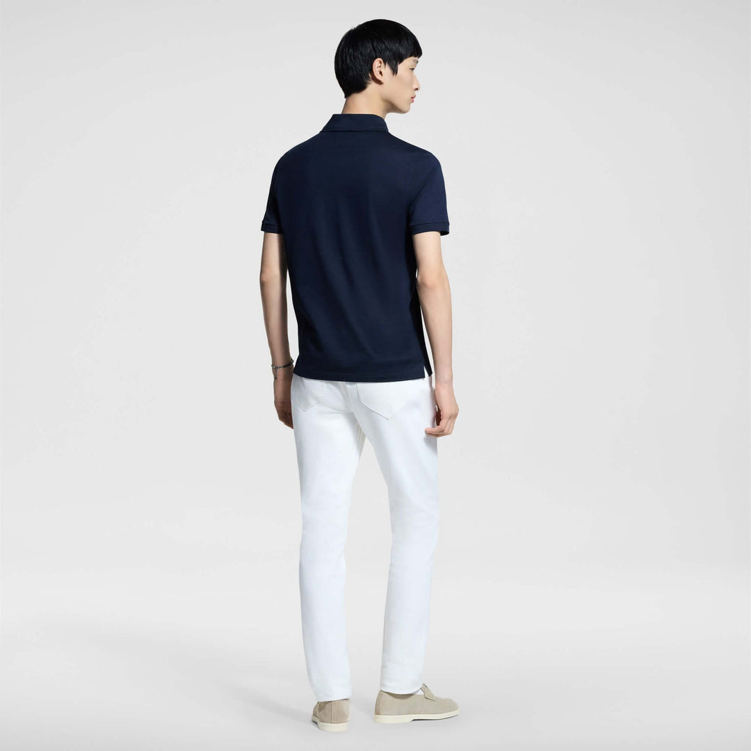 Man wearing LV Signature Luxury Trouser with navy polo shirt, showcasing a stylish and comfortable back view.